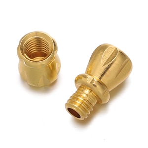 Macro view of brass screw connectors with gold finish for DIY jewelry and necklaces