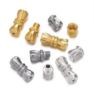 Macro detail of copper screw clasps with flower patterns for jewelry making