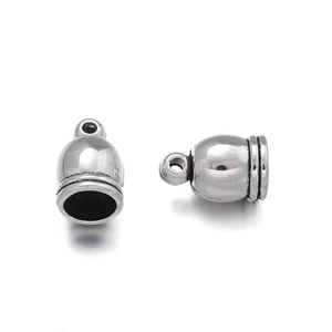 Detail showing vintage silver zinc alloy tassel end caps with crown head and hanging loops