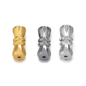 Detailed view of hourglass-shaped copper screw clasps with intricate floral engravings