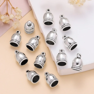 Detail of vintage silver tassel end caps with ring loop for DIY jewelry making