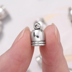 Macro shot of antique silver tassel end caps for DIY jewelry making and leather cords