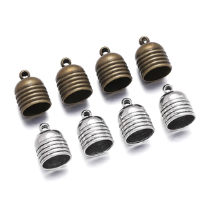 Macro detail of zinc alloy end caps with textured bell shape and top loop hooks
