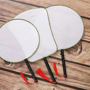 Three blank DIY white silk fans with floral edges and red tassels on wooden background