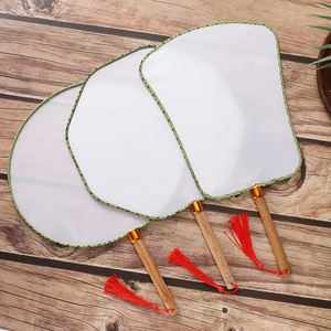 Three DIY white silk circular fans with green border, bamboo handle and red tassel