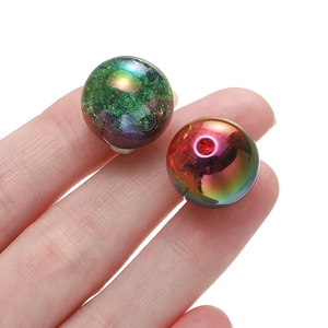 Macro detail of 16mm acrylic gradient beads with rainbow plating and ice crack texture