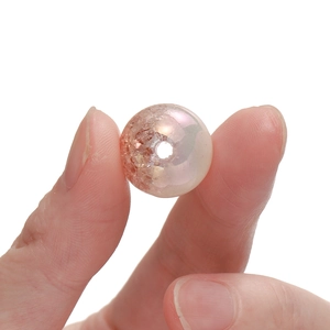 Detailed macro view of 16mm snowflake gradient acrylic bead with iridescent cracked texture
