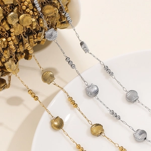 Macro detail of gold and silver shell pendant chain links for DIY jewelry making
