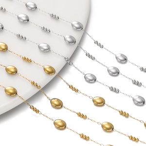 Close-up of gold and silver beaded oval link chains for DIY jewelry making and necklaces