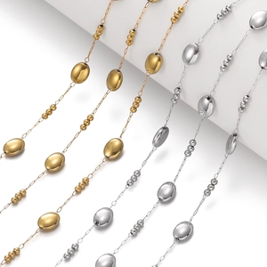 Detail of delicate gold and silver oval bead chains for DIY jewelry making