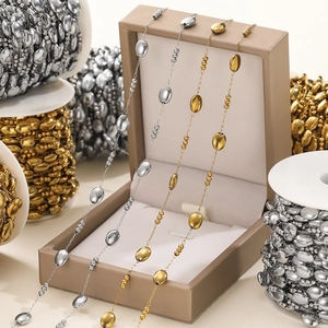 Macro detail of gold and silver oval beaded stainless steel chains for DIY jewelry making