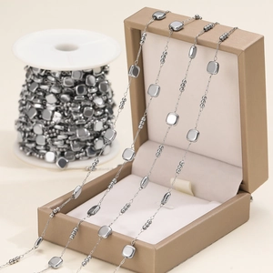 Macro detail of silver stainless steel square bead chain for DIY jewelry making