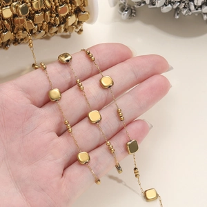 Detail of golden stainless steel square bead and round bead chain for DIY jewelry making