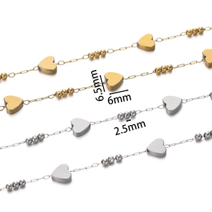 Macro detail of gold and silver heart-shaped beaded chains with precise size measurements