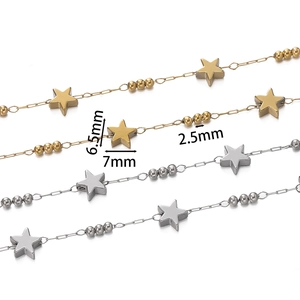 Detail of star-shaped charms and beads on stainless steel chains for DIY jewelry making