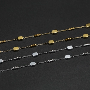 Detail of gold and silver hexagon geometric chain links for DIY jewelry making