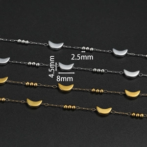Macro view of stainless steel chain with 2.5mm beads and 8mm crescent moon pendants