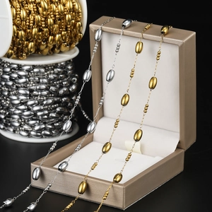 Detailed view of gold and silver oval bead chains for DIY jewelry making accessories