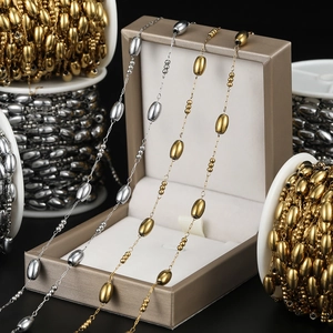 Detail of oval bead chain in gold and silver finish for DIY jewelry crafting