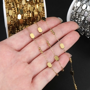 Detailed macro of gold and silver square link chain for DIY necklace and jewelry making