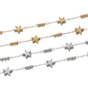 Detail of star pendants and beads on gold and silver plated stainless steel chains