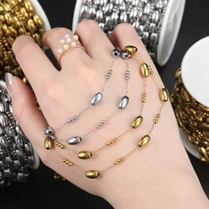 Detail of oval bead chain in gold and silver finish for DIY jewelry necklace making
