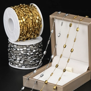 Macro view of gold and silver square beaded stainless steel chains for DIY jewelry making