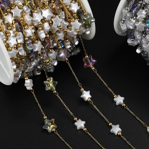 Detailed view of 18K gold-plated star beads chain on spool for DIY jewelry making