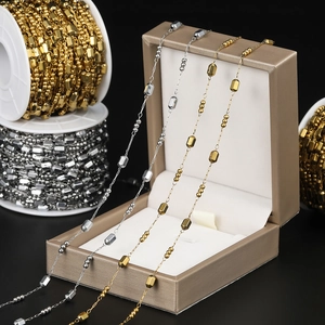Detailed view of gold and silver beaded metal chain for DIY necklace and jewelry making