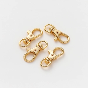 Macro detail of 14K gold plated 360-degree swivel lobster clasps for DIY jewelry making