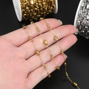 Detailed macro view of gold-plated stainless steel bead chain for DIY jewelry making