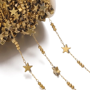 Macro shot of gold-plated stainless steel star and bead chain for DIY jewelry making