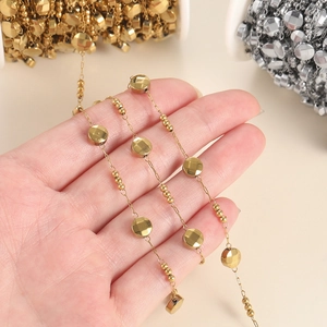 Close-up of gold and silver beaded chains for DIY jewelry making and necklace crafts