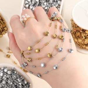 Detail of gold and silver beaded oval link chains for DIY necklace and bracelet crafting