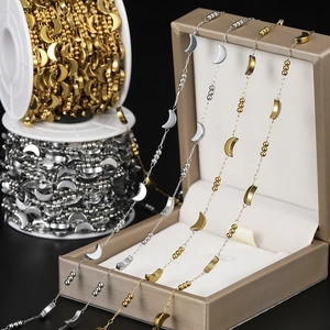 Detail of vacuum plated stainless steel chain with crescent moon and star beads