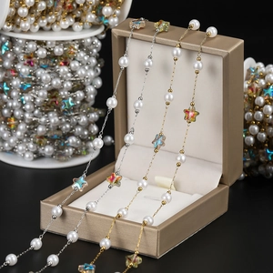 Detail of 18K gold and silver plated star chains with white pearls for DIY jewelry making