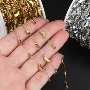 Detail of stainless steel heart chain with moon and star beads for DIY jewelry making