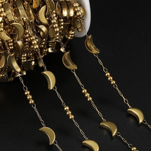 Gold stainless steel crescent moon and bead chain for DIY jewelry making on white spool
