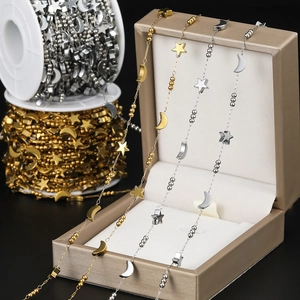 Detailed view of gold and silver star and moon link chains for DIY jewelry making