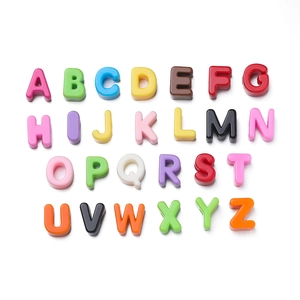 Macro view of multi-colored acrylic alphabet beads for DIY jewelry and bracelets