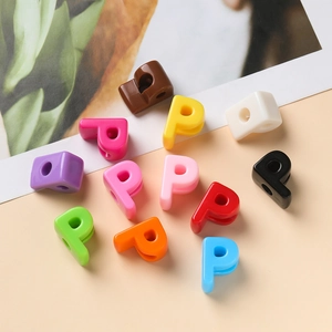 Macro view of colorful acrylic letter P beads for DIY handmade bracelet jewelry