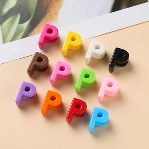 Close-up of colorful letter P acrylic beads with large holes for DIY jewelry making