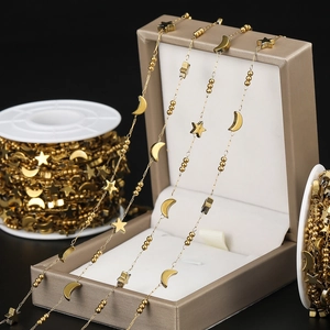 Detailed view of gold plated star and moon chain links for DIY jewelry making
