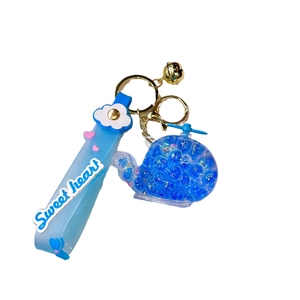 Luminous helicopter floating liquid keychain with blue bubble beads and silicone wrist strap