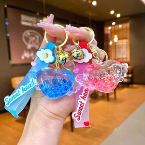 Portachiavi cuore con sabbie mobili liquide con ali e cinturino Sweet Heart