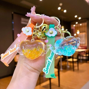 Portachiavi Sabbie Mobili a Cuore con Ali Luminose Ciondolo a Cartone Animato con Cinturino in Silicone per Borsa