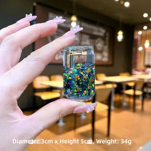 Porte-clés mini canette de soda avec liquide bleu et paillettes d'étoiles colorées