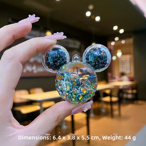 Détail du porte-clés Mickey avec perles bleues et paillettes étoiles, taille 6,4x3,8x5,5 cm