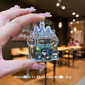 Détail du porte-clés château liquide avec paillettes étoiles colorées et dimensions exactes