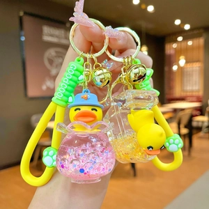 Cute floating yellow duck liquid keychain with gold bell and silicone strap charm